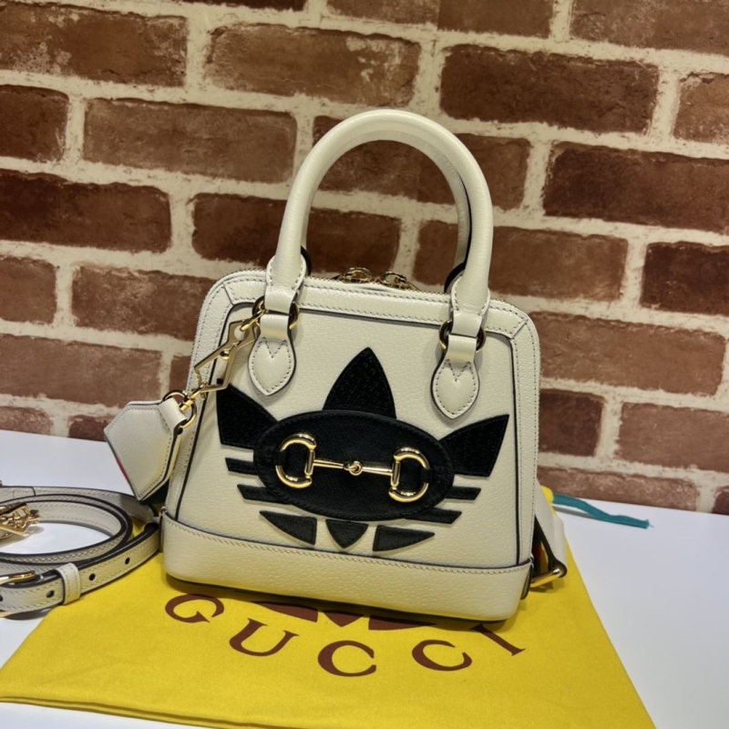 G*u*i top handle bags